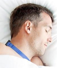 Advanced Brain Monitoring NightShift, a man sleeping peacefully with a meditative headset on his head.