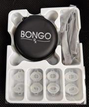B Medical BongoRx, medical device with round black component, multiple small white containers, and accessories in packaging