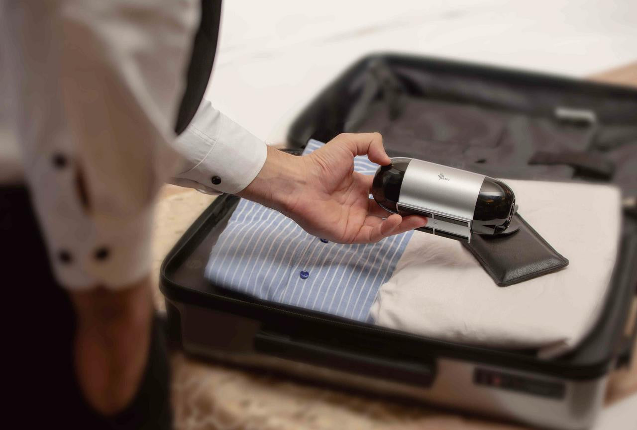 BMC M1 Travel Auto CPAP, portable sleep therapy device being prepared for travel in a suitcase.