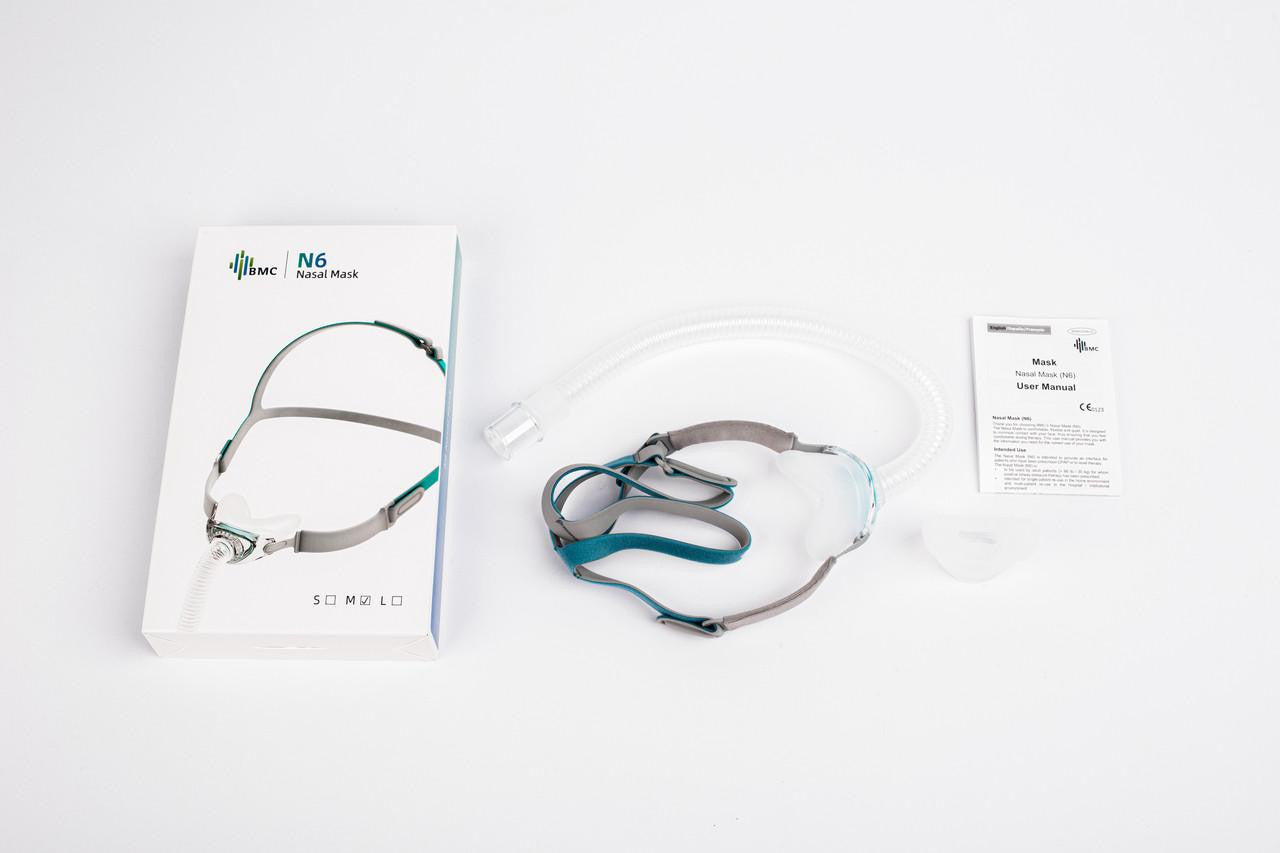 BMC N6 Nasal Mask Fitpack, all sizes included, with nasal mask, headgear, tubing, user manual, and face seal on a white surface.