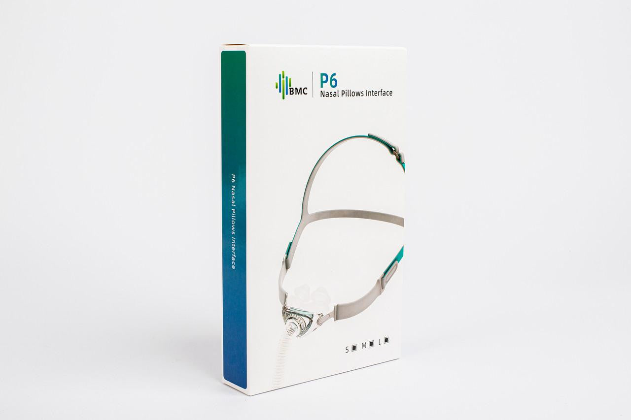 BMC P6 Nasal Pillows CPAP Mask Fitpack, all sizes included, with a white and teal packaging box featuring an image of the nasal pillows mask on a plain white background.