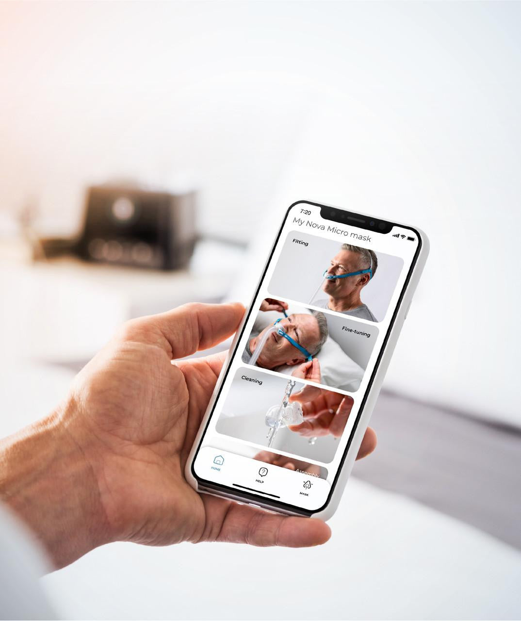Fisher and Paykel Healthcare Fisher and Paykel Nova Micro Pillows Mask Fitpack, smartphone displaying mask fitting, fine-tuning, and cleaning instructions.