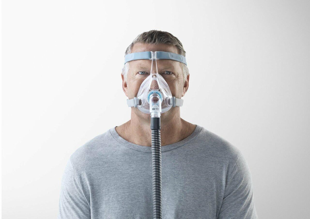 Fisher and Paykel Healthcare Fisher and Paykel Vitera CPAP Full Face Fitpack, man wearing a full face mask for sleep apnea therapy.