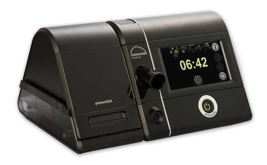 Lowenstein Prisma 20A with heated tube and humidifier, medical ventilator device with digital display and control knob.