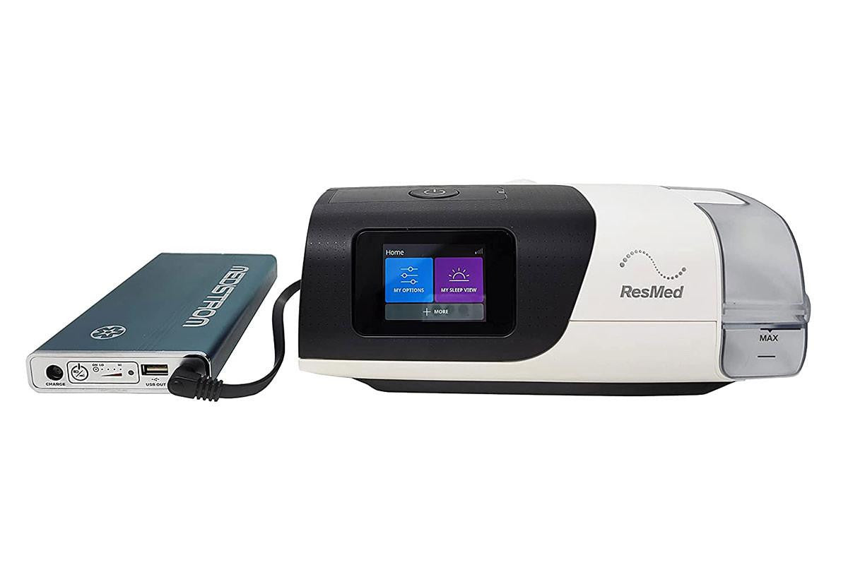 Medistrom ResMed AirSense 11 Kit for Pilot-24 Lite, medical device for sleep therapy with display screen and connected battery pack.