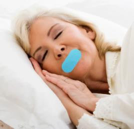 Nadu CPAP Mouth Tape, a blue mouth tape applied on a woman's lips while she sleeps to promote nasal breathing and prevent mouth leaks during CPAP therapy.