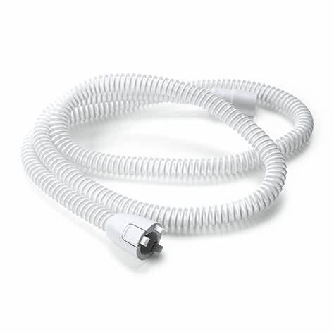 Philips Respironics DreamStation heated tube, a coiled medical breathing tube with a connector at one end.
