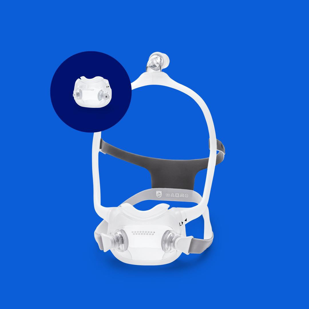 Philips Respironics DreamWear CPAP Masks, front view of the mask with nasal cushion and headgear on a blue background.
