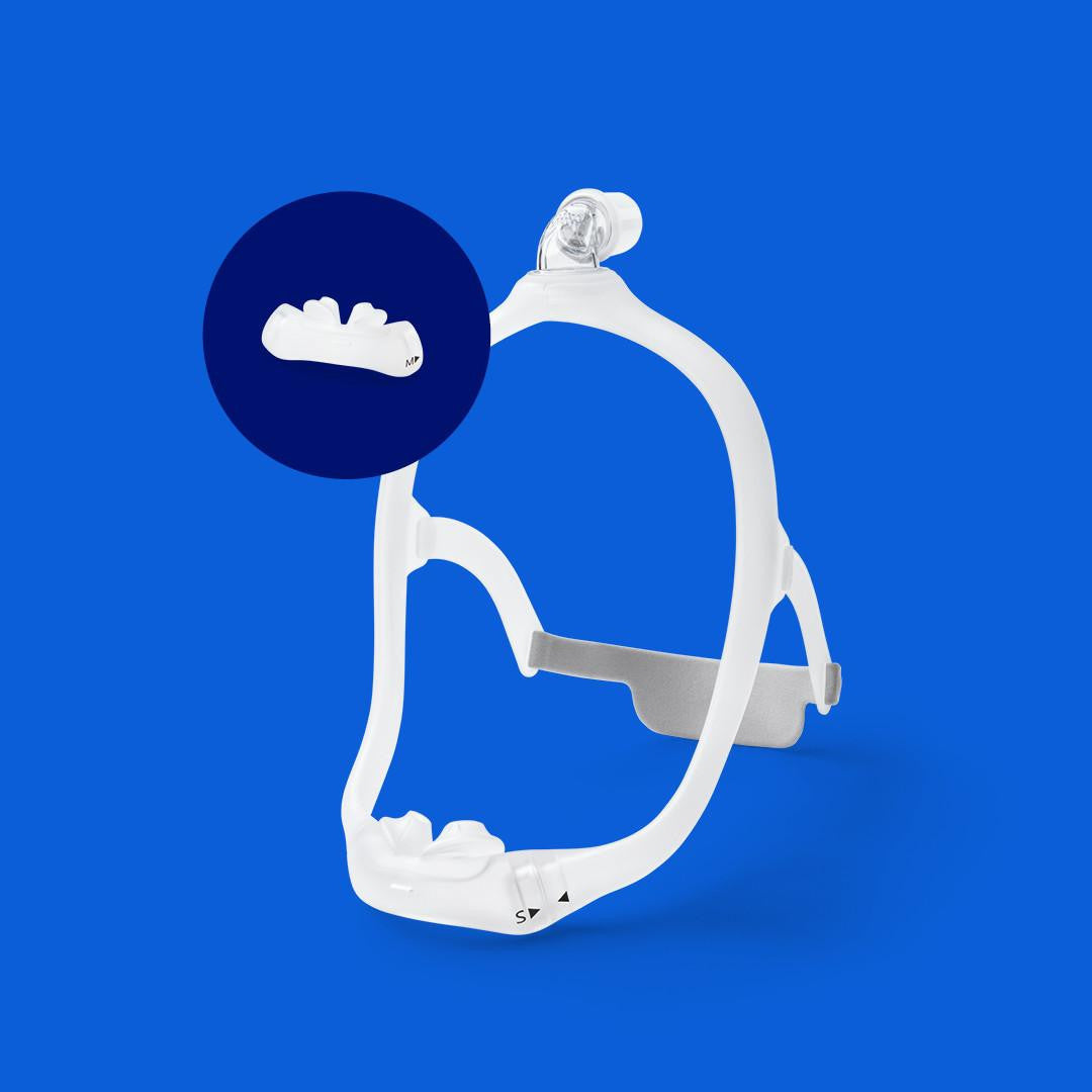 Philips Respironics DreamWear CPAP Masks, a sleek white CPAP mask frame with a transparent nasal cushion on a blue background.