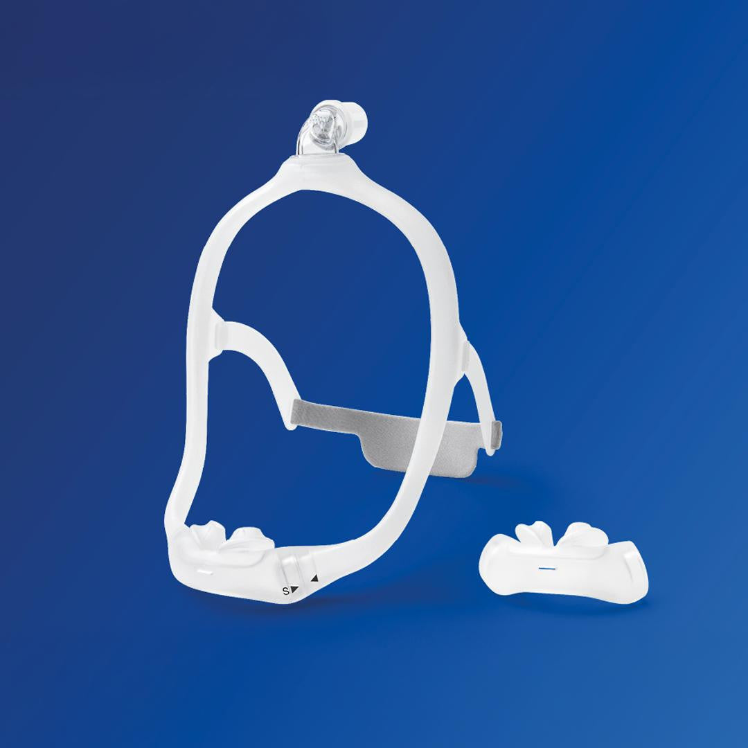 Philips Respironics Philips DreamWear Silicone Pillows CPAP mask, product with silicone pillow cushion and adjustable headgear on a blue background.