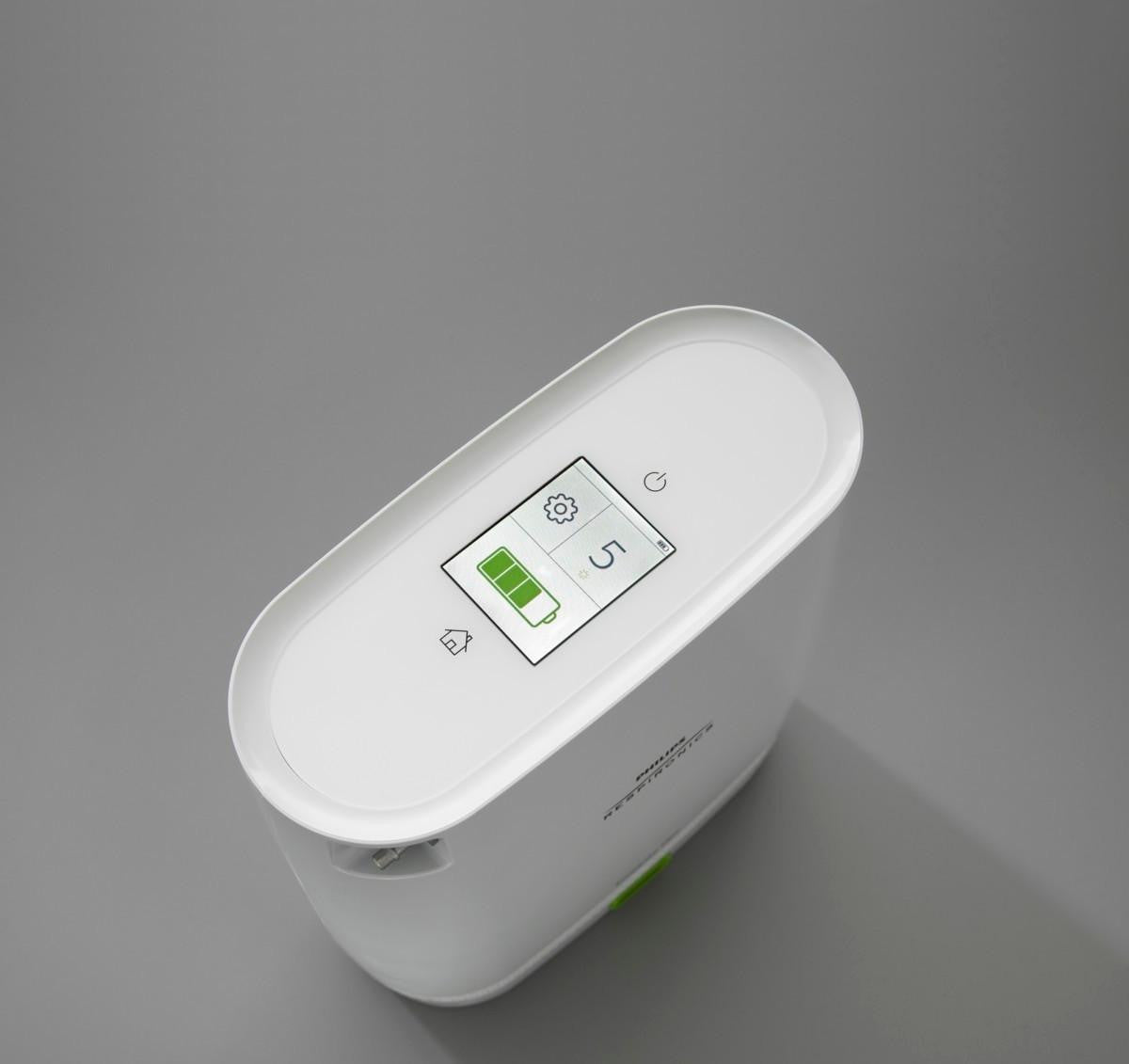 Philips Respironics SimplyGo Mini Standard Lithium Ion Battery, portable medical device battery with digital display showing battery life and settings.
