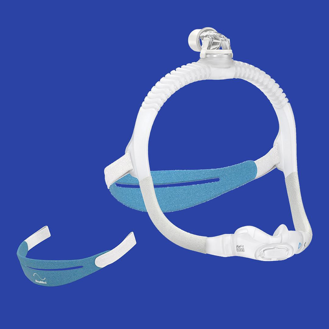 ResMed AirFit N30i CPAP mask, clear and blue mask with adjustable headgear against a blue background.