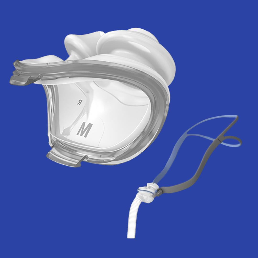 Resmed P10 Pillows Mask with clear nasal cushion with adjustable headstrap and attached breathing tube on blue background