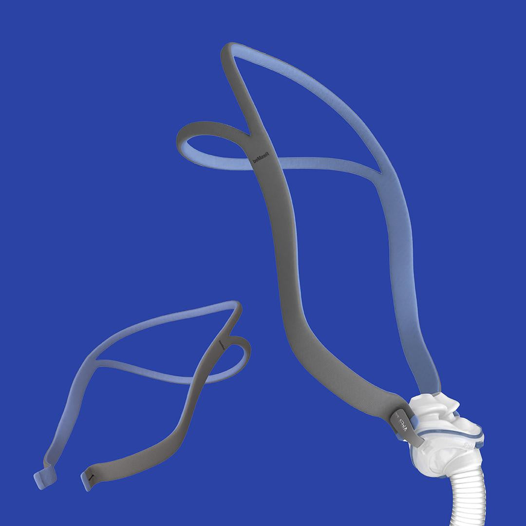 ResMed AirFit P10 Pillows Mask -  a lightweight nasal pillow mask with grey headgear and a white connector, designed for comfortable sleep therapy.