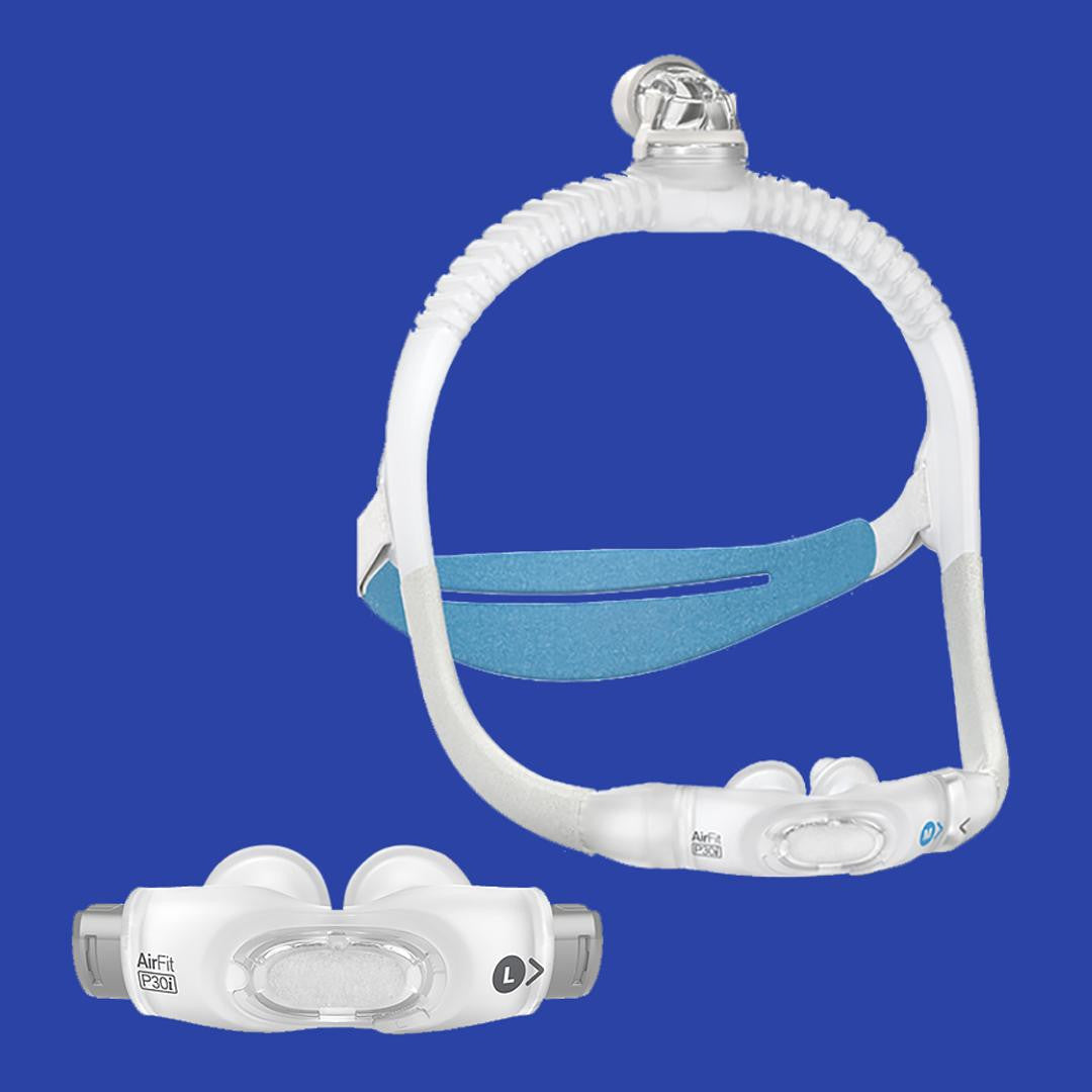 Resmed ResMed AirFit P30i Pillows mask, a clear nasal pillow mask with adjustable straps and a blue cushion for comfortable sleep therapy.